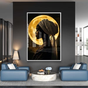 May include: A black and white portrait of a woman wearing a white head wrap, with a large yellow moon behind her. The woman is looking to the side, and the moon is partially obscured by her head wrap.