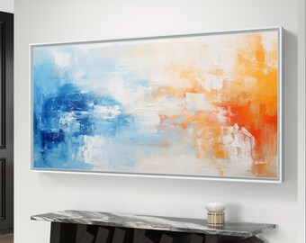 May include: Abstract oil painting in a white frame, featuring a blend of blue, white, and orange hues. The artwork hangs above a modern console table with a marble top and a geometric black base. A small decorative object sits on the table.