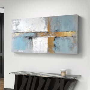 Abstrakte goldene und petrolfarbene Leinwand mit strukturierten goldenen und blauen Pinselstrichen in einem modernen Design