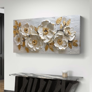 May include: White and gold floral painting on canvas with a textured, 3D effect. The flowers are arranged in a horizontal row and have a realistic appearance.