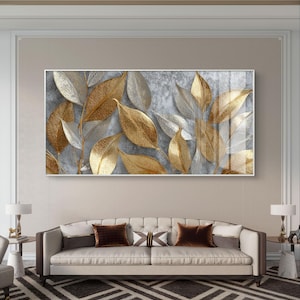 Gold and silver leaves on textured grey