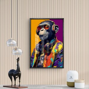 May include: A framed art print featuring a chimpanzee wearing sunglasses and headphones. The chimpanzee is dressed in a colorful jacket with a yellow, red, and purple design. The background is a gradient of yellow and purple.