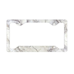 May include: A rectangular number plate frame with a white marble effect and grey veining. The frame has four mounting holes and a rectangular aperture for the number plate.
