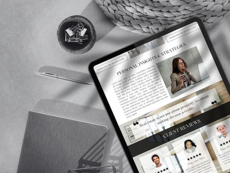 May include: A black and white image of a tablet screen displaying a website for a real estate company. The website features a quote about real estate being about making dreams a reality. The website also includes client reviews with five-star ratings.