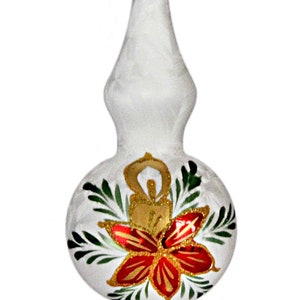 May include: White glass Christmas tree topper with two round bulbs. Each bulb has a red and gold poinsettia with green leaves painted on it.