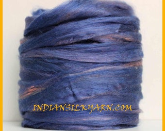 May include: A close-up of a skein of blue and pink silk yarn. The yarn is soft and fluffy, and it is perfect for knitting or crocheting. The yarn is labeled "INDIAN SILKYARN.COM".