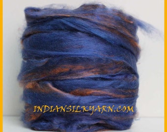 May include: A bundle of blue and orange silk yarn. The yarn is soft and fluffy, and it is perfect for knitting or crocheting. The yarn is available in a variety of colors, and it is sure to add a touch of elegance to any project.  INDIAN SILKYARN.COM