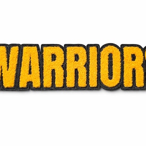 May include: A yellow and black embroidered patch with the word "WARRIORS" in bold, block letters. The letters are yellow with a textured appearance, outlined in black. The patch is likely for a sports team or organization.