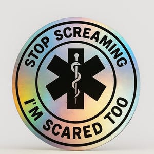 May include: A round, holographic sticker with the text "STOP SCREAMING I'M SCARED TOO" encircling a black Star of Life symbol with a white caduceus. The sticker has a rainbow sheen.