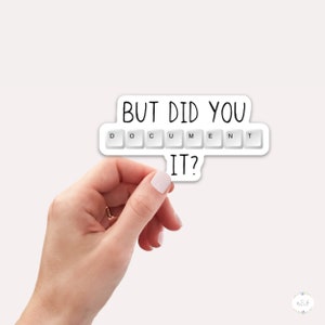 May include: White sticker with the text "But did you document it?" with the word "document" spelled out using white computer keys.