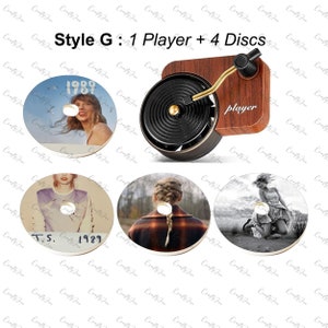 There are a records player and 4 vinyl air freshener with 4 discs Taylor Swift albums cover which are 1989 (Taylor’s Version),1989,Evermore and Taylor Swift photo