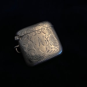 Antique silver Vesta case, British silver hallmark, Scroll etched design, hinged lid. Circa 1907 . WHH British designer from LIBERTY & Co.