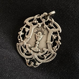 Antique silver Catholic medal