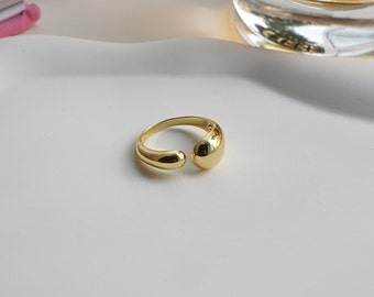 Dikke zilveren ring · opvallende ring · vergulde oorbel · dubbele zilveren ring · druppelring · open ring · vloeibaar metaal · sieradencadeau