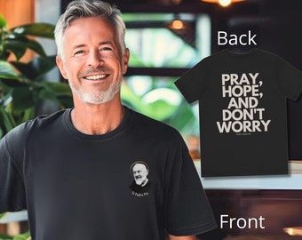 May include: Black t-shirt with a small image of St. Padre Pio on the front and the text "Pray, Hope, and Don't Worry" on the back.