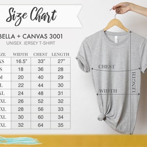 May include: A light gray unisex jersey t-shirt hanging on a wooden hanger. The image includes a size chart with measurements in inches for width, chest, and length. The size chart is for Bella + Canvas 3001 shirts.