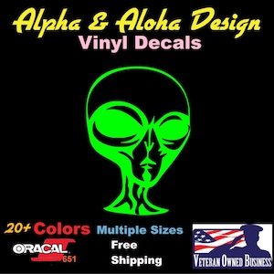 May include: Green alien head vinyl decal with black outline.  The decal is available in 20+ colors and multiple sizes.  Free shipping.  Alpha & Aloha Design.  Veteran Owned Business.