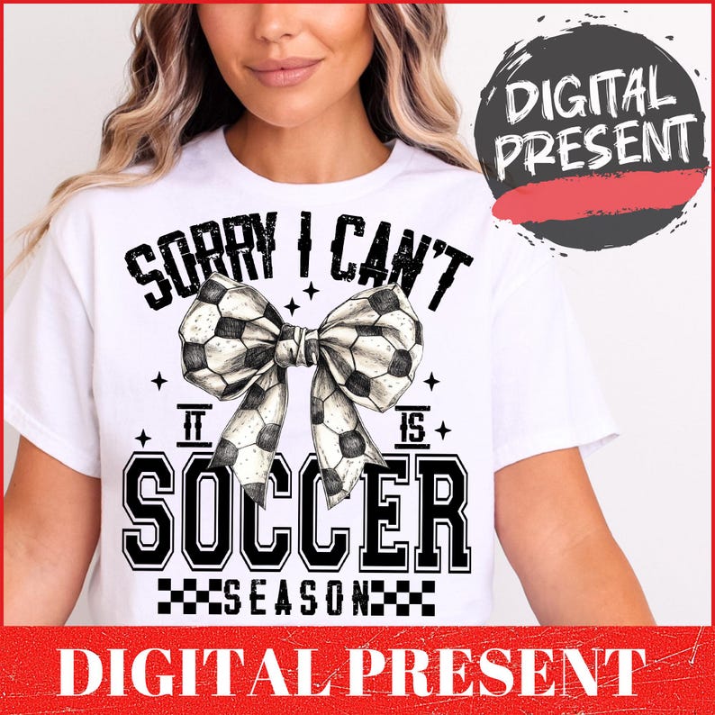 May include: White t-shirt with black text that reads "Sorry I can't it is soccer season" with a black and white soccer ball bow.