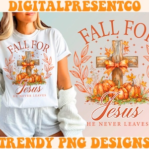 May include: White t-shirt with a fall-themed design featuring a cross with pumpkins and leaves. The text "Fall for Jesus" and "He Never Leaves" is printed on the shirt.