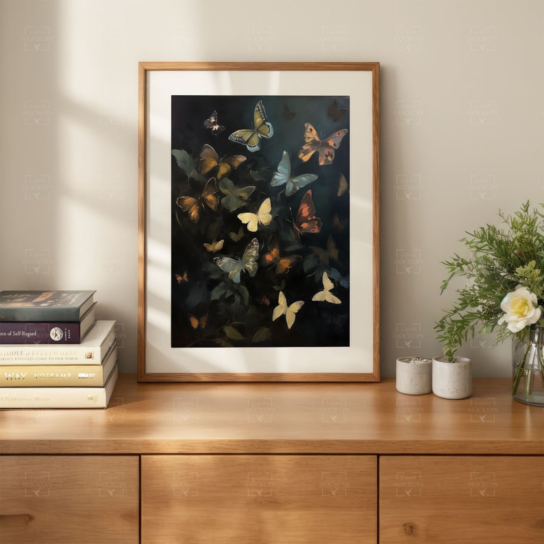 May include: A framed print of a dark background with a cluster of colorful butterflies in various shades of blue, yellow, orange, and brown. The butterflies are arranged in a random pattern, creating a sense of movement and energy.