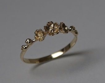 Cherry Blossom Ring ∙ A trio of petite sakura florals, handcrafted in solid gold.