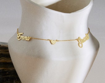 May include: Gold necklace with two names, "Emma" and "Jacob", and a small heart charm.