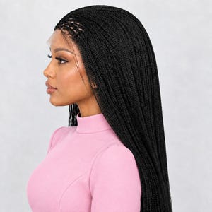 May include: A black braided lace front wig featuring long, thin, uniform micro-braids that cascade down the back. The wig is styled with a side part and a sheer lace front edge that blends along the hairline, creating a natural appearance.