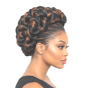 May include: A hairstyle featuring intricate cornrow braids along the scalp that transition into a large, voluminous bun composed of thick, twisted sections of hair in a blend of black and warm brown tones, styled in a high, rounded arrangement.