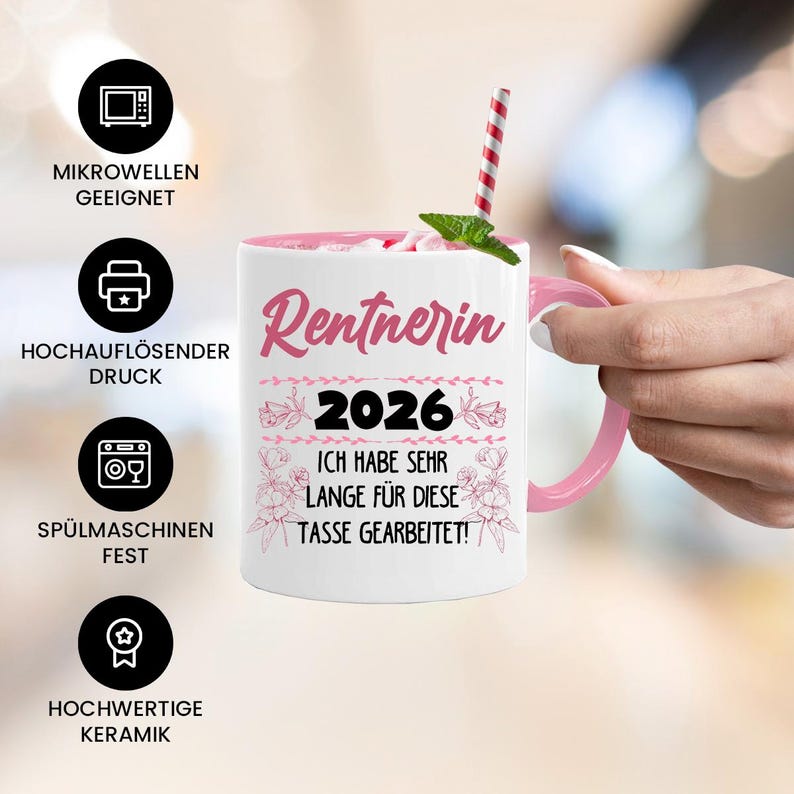 May include: A white ceramic mug with a pink interior and handle. The mug features the word "Rentnerin" in pink script, the year "2026", and the phrase "ICH HABE SEHR LANGE F&Uuml;R DIESE TASSE GEARBEITET!" in German. A red and white striped straw is in the mug.