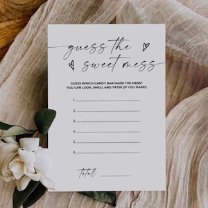 May include: A printable game card with the text "guess the sweet mess" and instructions to guess which candy bar made the mess. The game card has six blank lines for players to write their guesses and a line for the total.