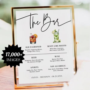 May include: A gold-framed sign with the text "The Bar" in black cursive script. The sign lists various alcoholic and non-alcoholic beverages, including Old Fashioned, Minty Lime Mojito, beer, wine, and non-alcoholic options. The sign also includes the names Olivia and Brandon and the date 08.25.20XX.