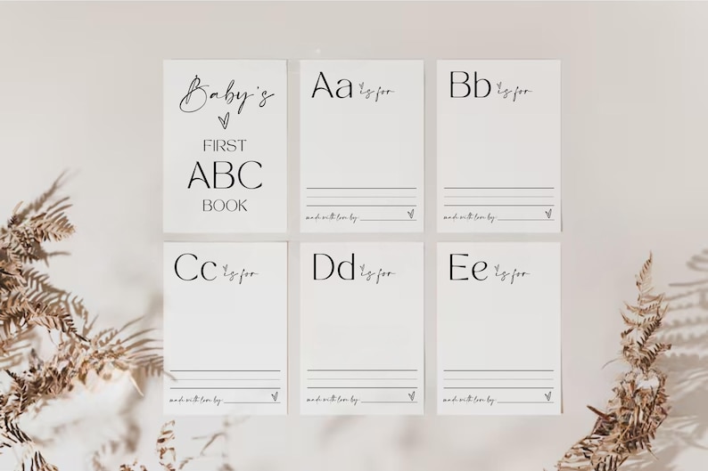 May include: A set of six blank cards with a simple black and white design. Each card features a letter of the alphabet, the word "for", and a line for writing. The cards are titled "Baby's First ABC Book".