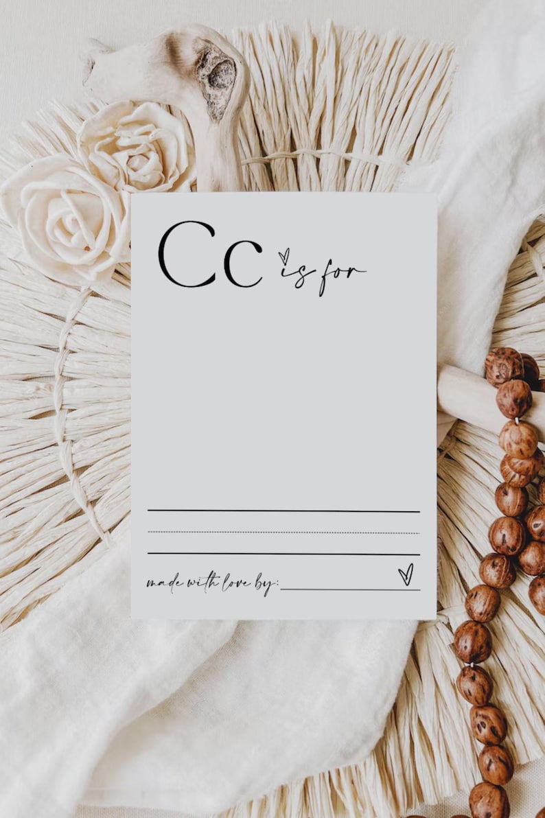 May include: A white card with the letter "C" and the text "C is for" written in black. There are two lines for writing and the text "made with love by:" at the bottom of the card.