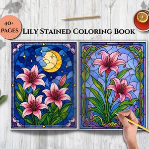 May include: A Lily Stained Coloring Book with 40+ pages. The open book displays two pages featuring stained glass style illustrations of pink lilies. One page shows lilies under a yellow crescent moon, while the other shows lilies in a frame.