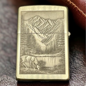 Nature's Majesty: Brass Zippo Lighter with Mountains and Deer Engraving