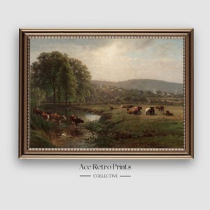 May include: A vintage painting depicting a pastoral scene with a stream running through a field. The painting features a group of brown and white cows grazing in the field, with a lush green forest in the background. The sky is a light blue with fluffy white clouds.