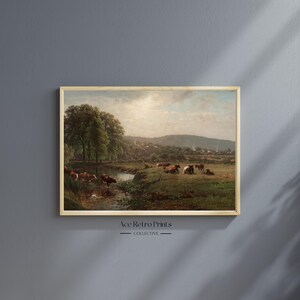 May include: A vintage painting depicting a pastoral scene with a stream running through a grassy field.  The painting features a group of cows grazing in the field, with a lush green forest in the background.  The sky is a light blue with fluffy white clouds.