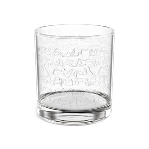 May include: A clear, cylindrical drinking glass with a decorative pattern of interconnected line drawings. The glass has a thick base and a wide opening, suitable for various beverages. The design is etched onto the glass, creating a subtle, elegant aesthetic.