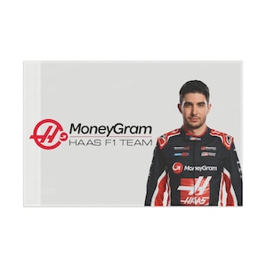Esteban Ocon Haas-vlag 2025