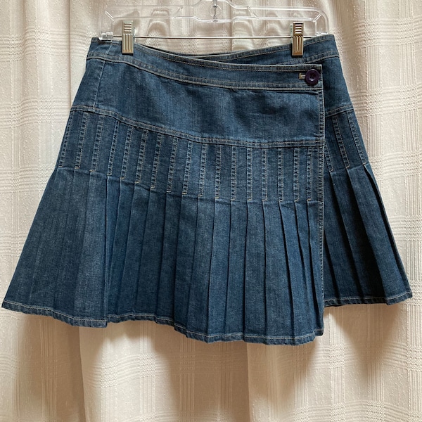 1990s City DKNY vintage pleated wrap blue denim skirt. Short mini skirt asymmetric waist. Stitched pleats all around. Size 6, 30” waist.