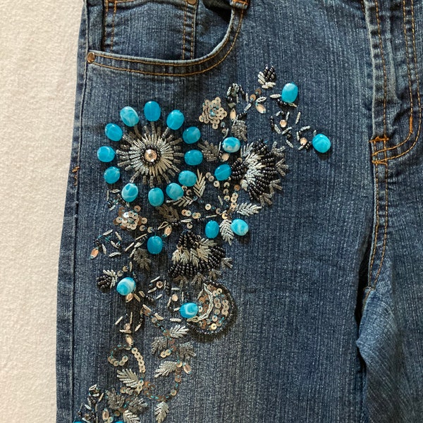 Embellished vintage denim blue jeans with beads, sequins, embroidery and faux jewels. Cache label size 8 medium