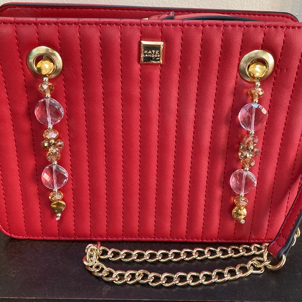 Red upcycled Kate Landry crossbody bag purse with 2 handmade bead dangles.  Gold tone trim and chain strap. Embellished purse