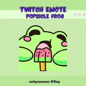 May include: Green cartoon frog with big eyes and pink cheeks eating a watermelon popsicle.  The frog is looking up and has its mouth open.  The popsicle is on a stick and has a pink and red watermelon design.  The background is a light green with white dots.