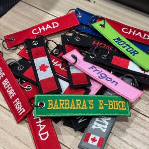 A collection a different custom embroidered keytags