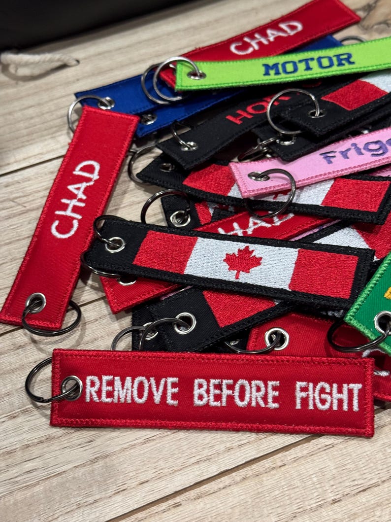 A collection a different custom embroidered keytags