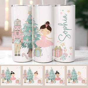 May include: White tumbler featuring a Nutcracker soldier, a ballerina in a pink tutu, and a Christmas tree with gifts. The third tumbler has the name "Sophia" in a script font. The design includes stars and candy canes.