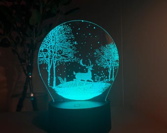 Regalo de Navidad, luz nocturna 3D de ciervo bajo la nieve