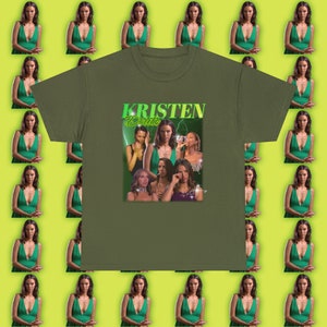 May include: Olive green t-shirt with a graphic print of a woman's face with the text "Kristen Doute" in green and white.