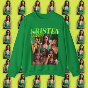 May include: Green sweatshirt with a graphic print of a group of women with the text "KRISTEN Doute" in a retro style.