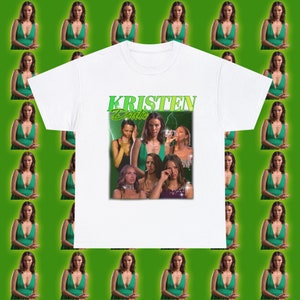 May include: White t-shirt with a graphic print of a woman's face and the text "KRISTEN Doute".